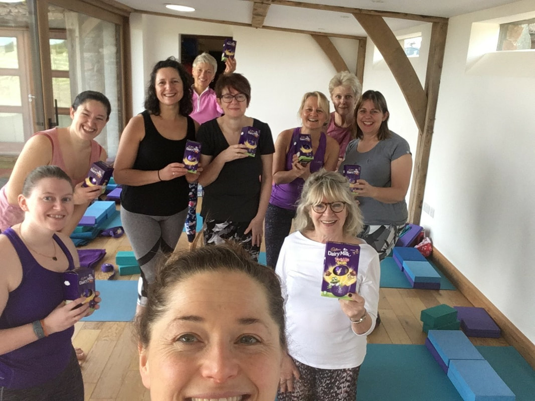 Photo of yoga group with easter eggs