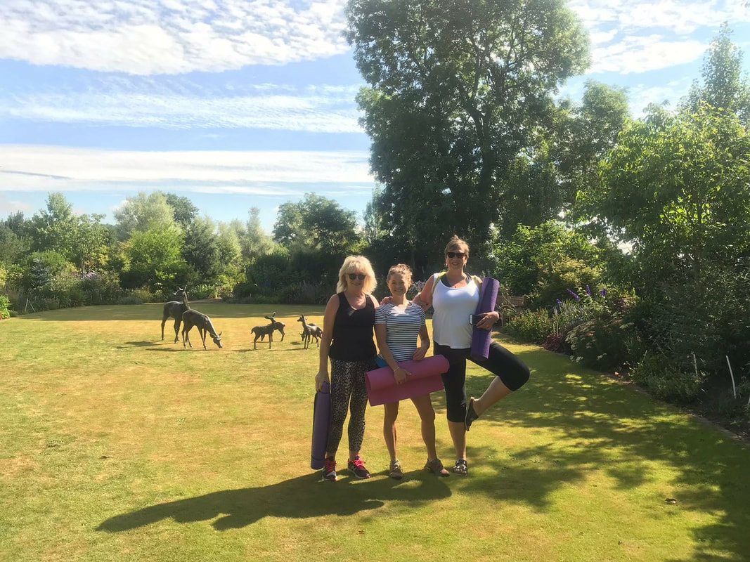 Picture of yoga on the lawn at larch cottage